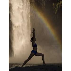 Young Woman Practicing Yoga on a Rock, Snoqualmie Falls, Washington 