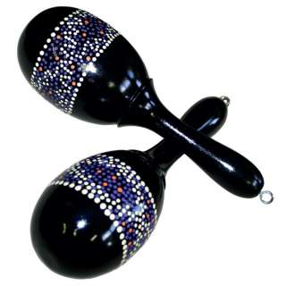 Hand painted black wooden maracas with dot pattern.