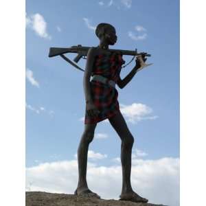 of an Armed NyagAtom Herdsman on the Banks of the Omo River, Ethiopia 