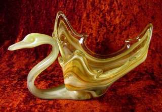   the glamorous swan glimmering shades of orange amber yellow glass that