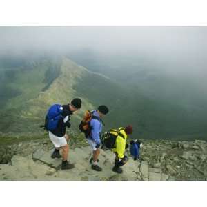  Hikers Descend Stone Stairs High Atop Mount Snowdon 