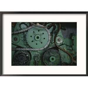 close view of gears and a drive chain on a piece of machinery Framed 