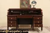   roll top desk from the early 1900 s has a superb deep rich finish