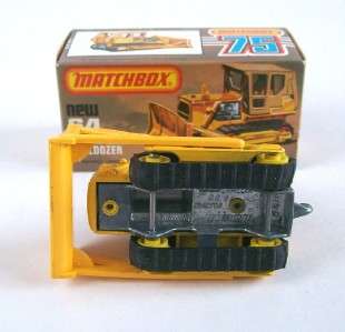   in yellow with brown detachable cab, black rubber caterpillar treads