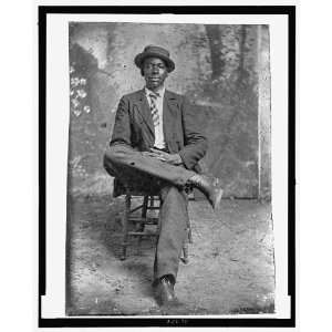  Portrait of African American man,Seated,wearing top hat 