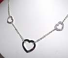 GUESS STEEL LADY NECKLACE WITH HEARTS UBN81082