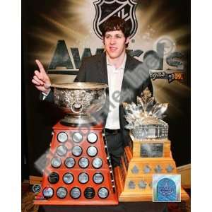  Evgeni Malkin with the Art Ross Trophy and Conn Smythe 