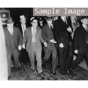  1936 Charles Lucky Luciano, handcuffed to two deputies 