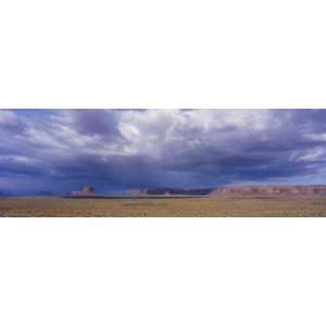  Voluminous Clouds Hover over an Expansive Valley Stretched 