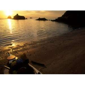 Scenic of a Kayak and the Sun Setting over the Oceans Horizon, Baja 